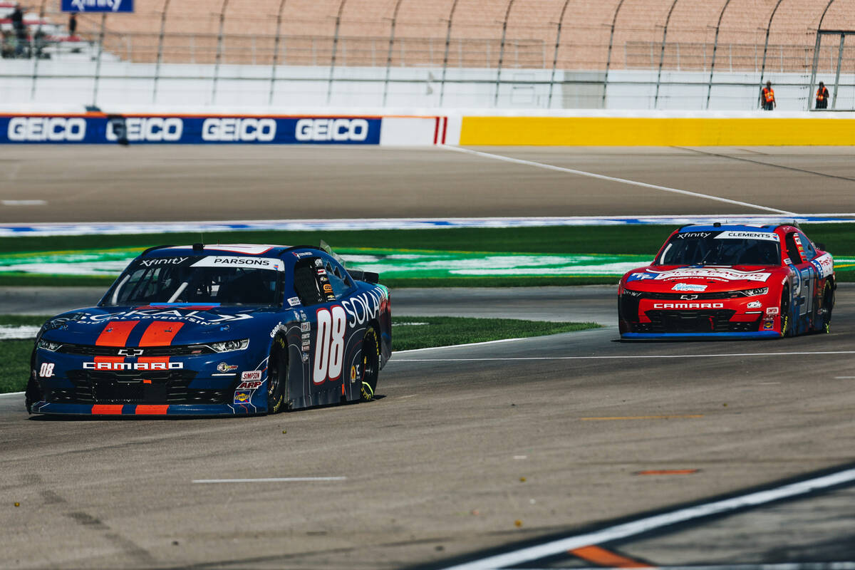 Race car drivers make their ways to their pit crews during the NASCAR Xfinity Series race at th ...