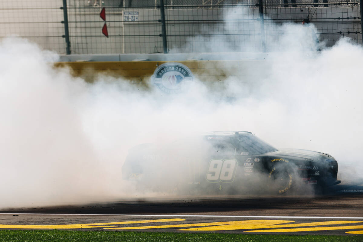 Riley Herbst celebrates winning first place in the NASCAR Xfinity Series race at the Las Vegas ...