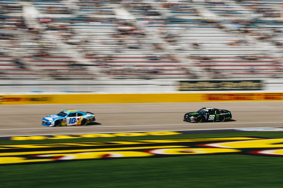 Austin Dillon (10) and Riley Herbst (98) race their cars along the track during the NASCAR Xfin ...