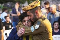 Friends and relatives of Ilai Bar Sade mourn during his funeral at the military cemetery in Tel ...