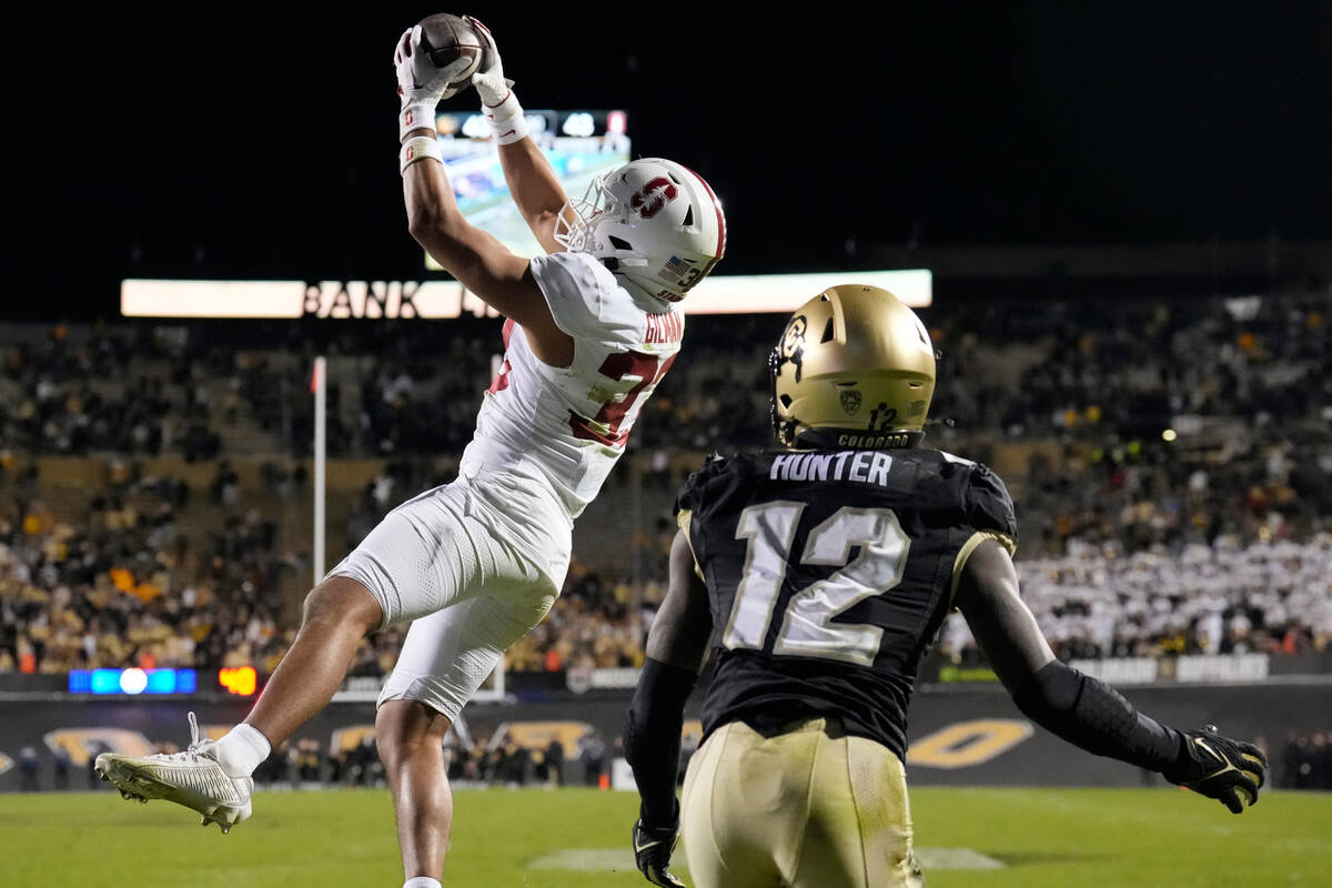 Stanford safety Alaka'i Gilman, left, intercepts a pass intended for Colorado wide receiver Tra ...