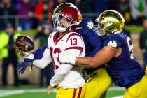 Southern California quarterback Caleb Williams (13) attempts to throw the ball as Notre Dame li ...