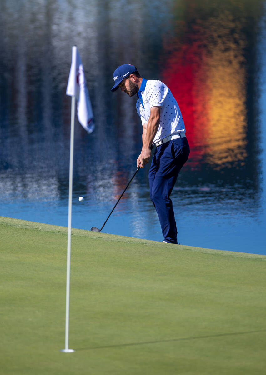 Callum Tarren chips a shot onto the green after going in the water on hole 17 during day 3 play ...