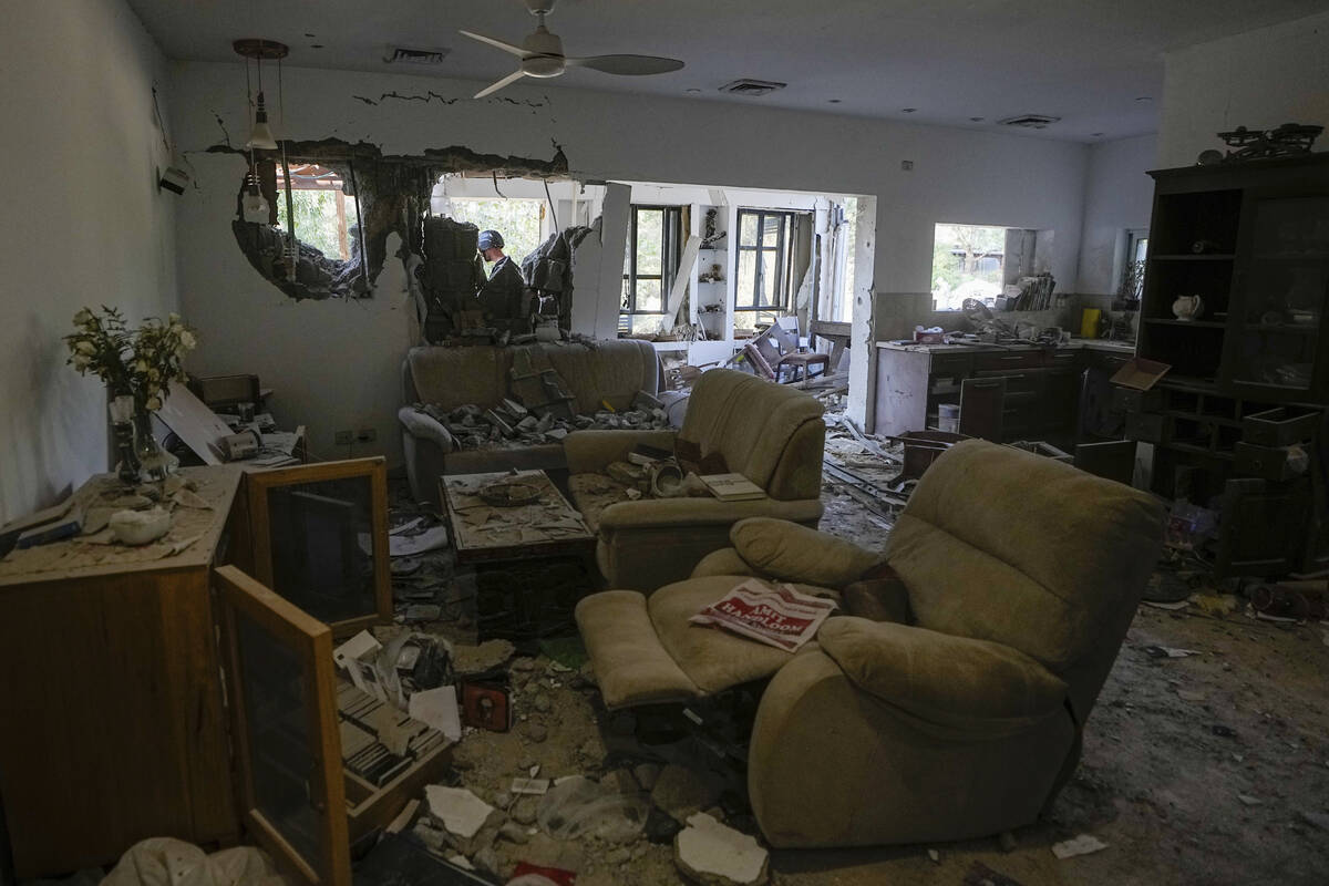 A house damaged by Hamas militants is seen in Kibbutz Be'eri, Israel, Saturday, Oct. 14, 2023. ...