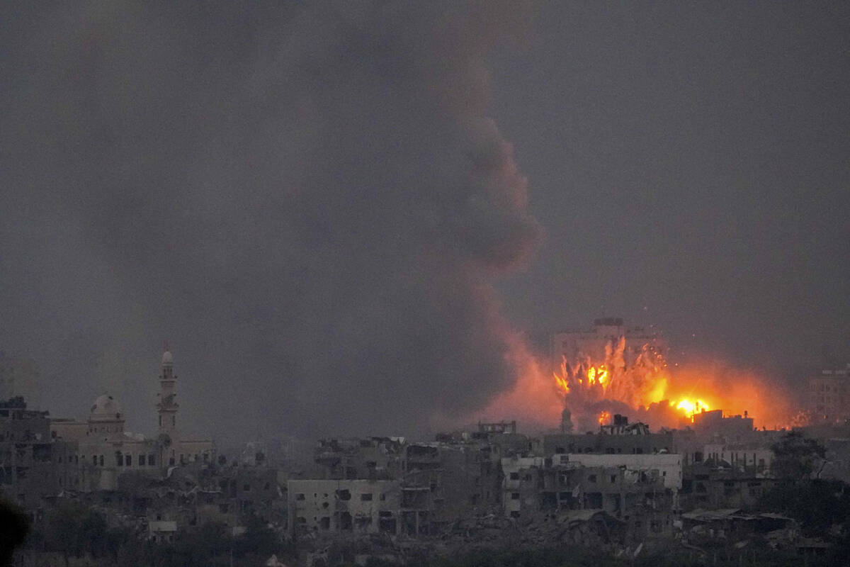 Smoke and fire rise following an Israeli airstrike in the Gaza Strip is seen from southern Isra ...