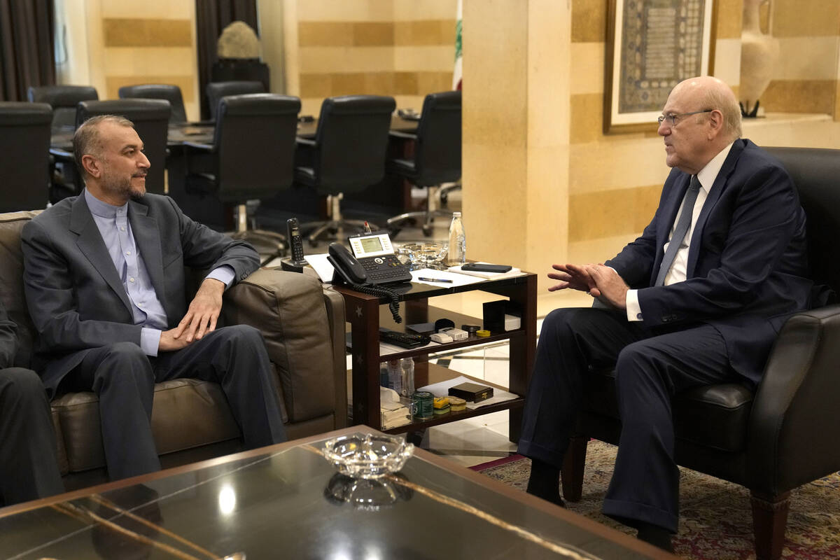 Lebanese Prime Minister Najib Mikati, right, meets with the Iranian Foreign Minister Hossein Am ...