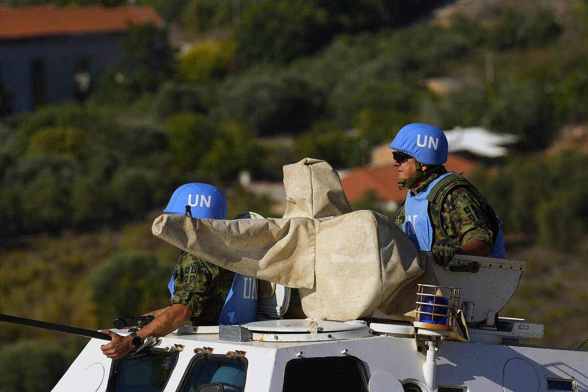 U.N. peacekeepers patrol on the Lebanese side of the Lebanese-Israeli border in the southern vi ...