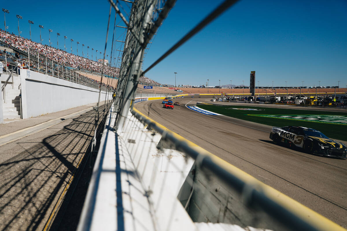 Race cars speed throughout the track during the South Point 400 at the Las Vegas Motor Speedway ...