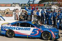Kyle Larson celebrates on top of his car after winning the South Point 400 at the Las Vegas Mot ...