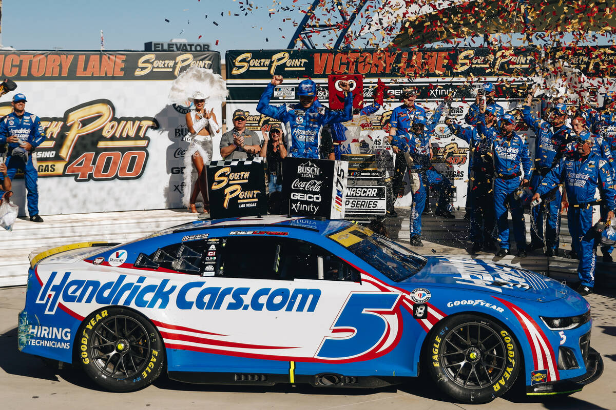 Kyle Larson celebrates on top of his car after winning the South Point 400 at the Las Vegas Mot ...