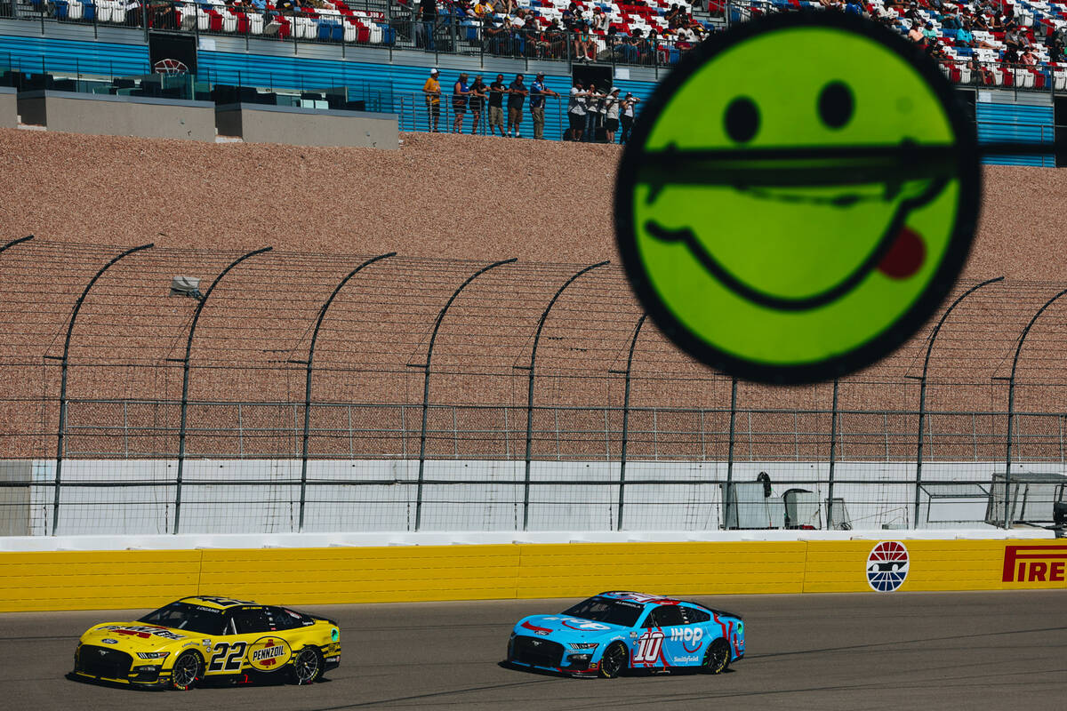 A signal stick sticks out as racers drive throughout the track during the South Point 400 at th ...