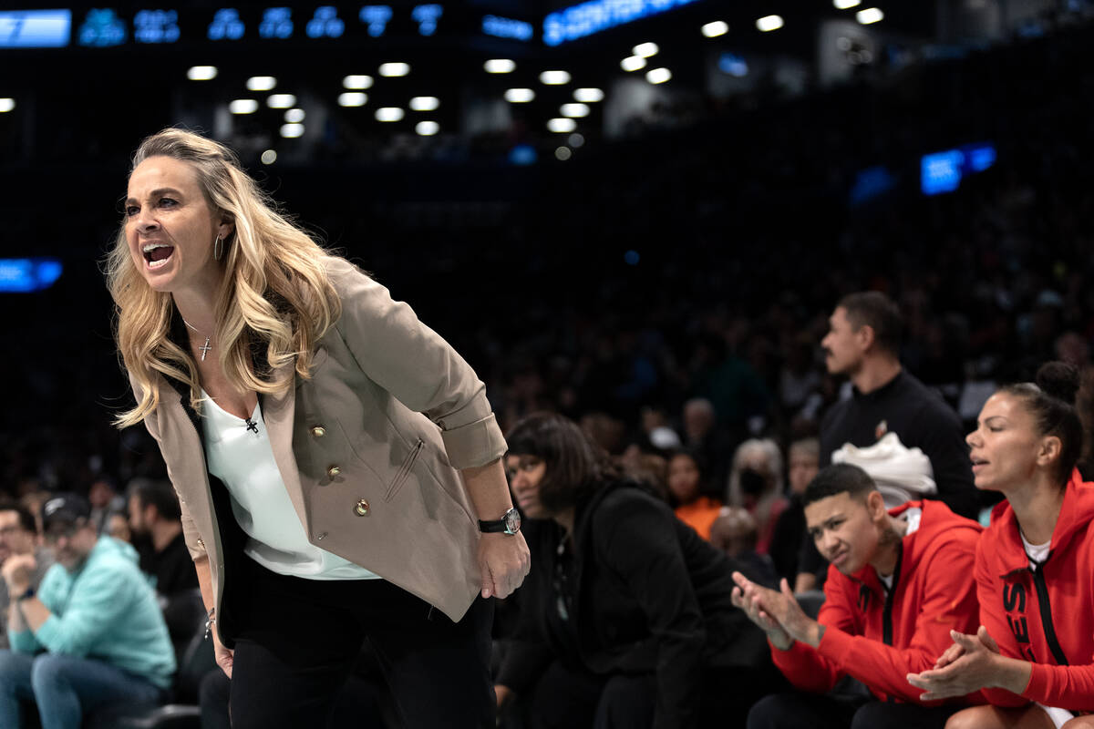 Las Vegas Aces head coach Becky Hammon disputes a foul with a referee during the first half in ...