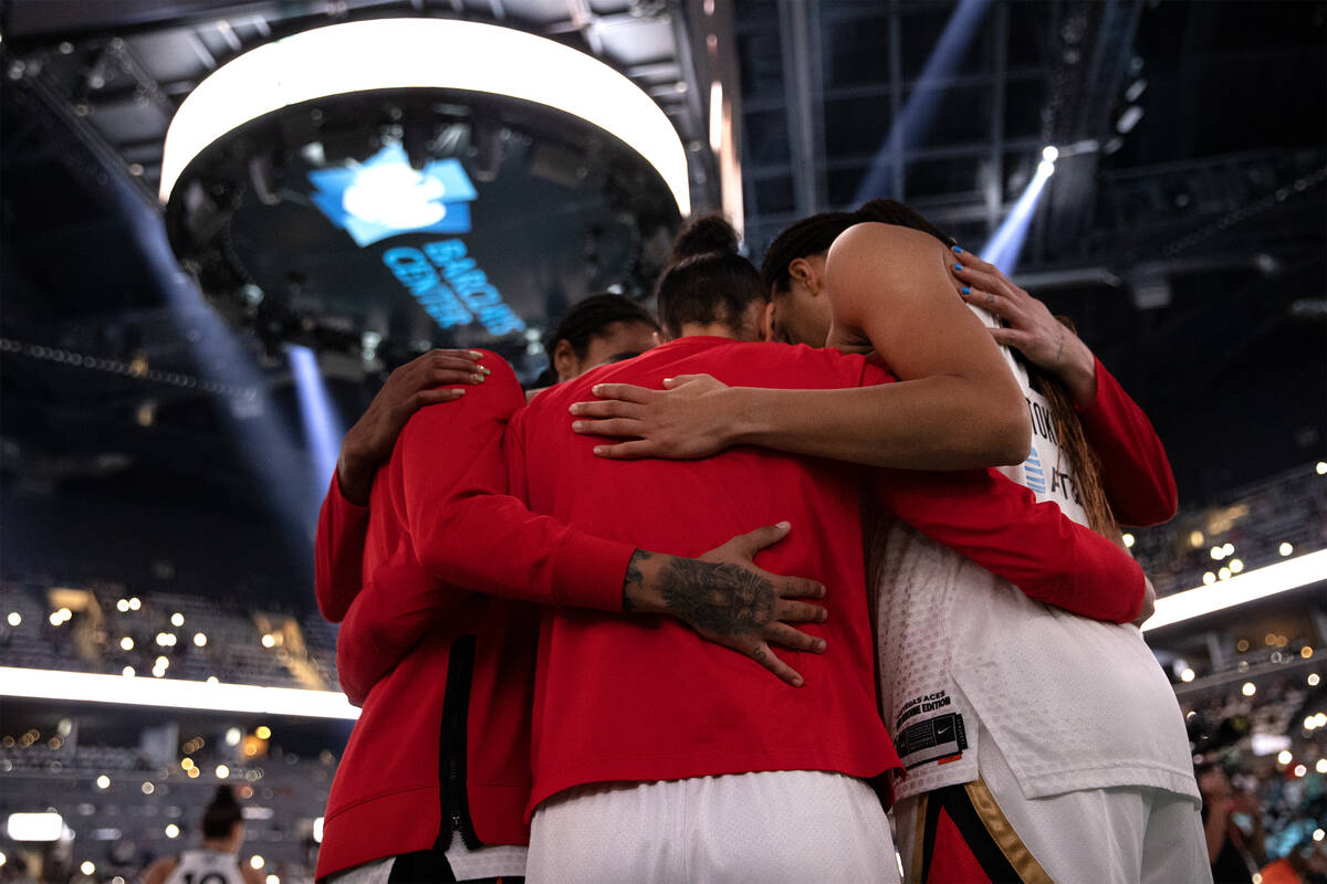 The Las Vegas Aces embrace before Game 3 of a WNBA basketball final series against the New York ...