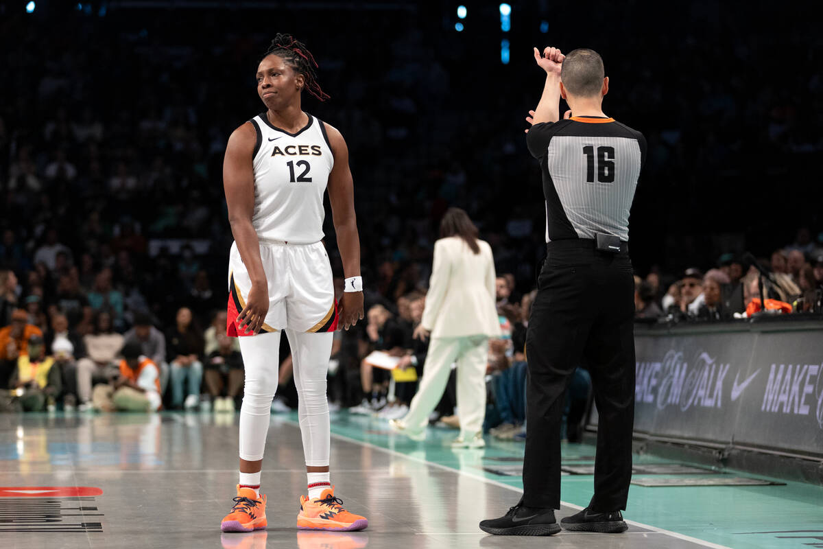 Las Vegas Aces guard Chelsea Gray (12) reacts after a referee charged her with a foul during th ...