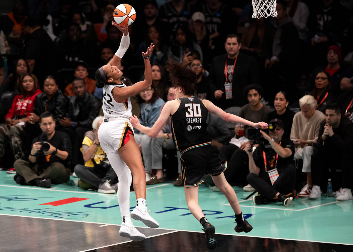 Las Vegas Aces forward A'ja Wilson (22) is fouled by New York Liberty forward Breanna Stewart ( ...