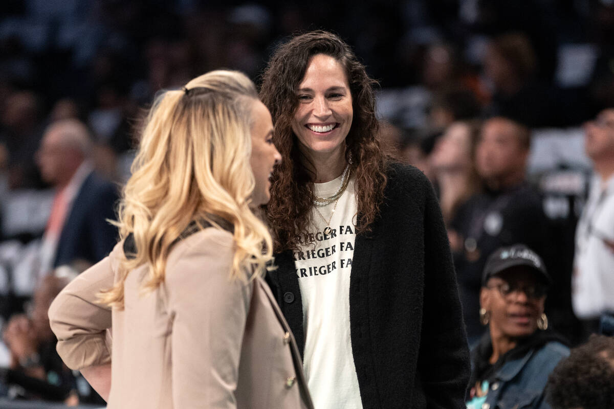 Former WNBA star Sue Bird talks to Las Vegas Aces head coach Becky Hammon before Game 3 of a WN ...