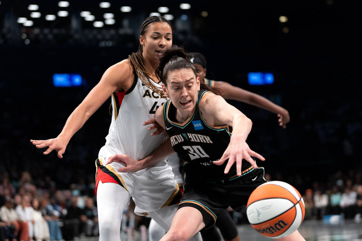 New York Liberty forward Breanna Stewart (30) works to keep the ball in bounds while Las Vegas ...