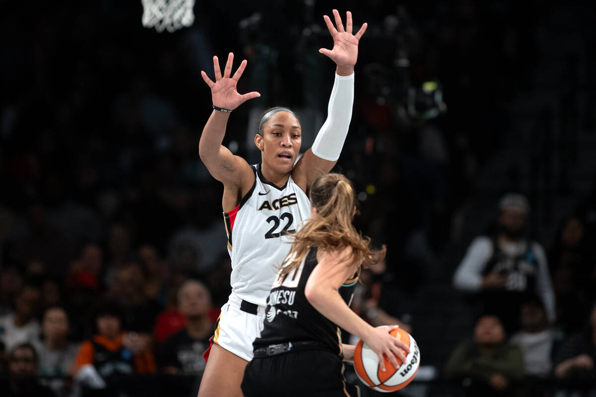 Las Vegas Aces forward A'ja Wilson (22) defends against New York Liberty guard Sabrina Ionescu ...