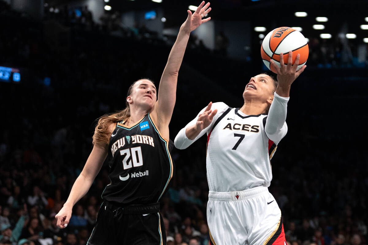 Las Vegas Aces forward Alysha Clark (7) shoots against New York Liberty guard Sabrina Ionescu ( ...