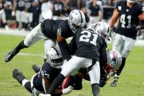 New England Patriots wide receiver Ty Montgomery II (14) tackled by Raiders linebacker Divine D ...