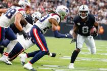Raiders running back Josh Jacobs (8) runs with the ball during the first half of an NFL footbal ...