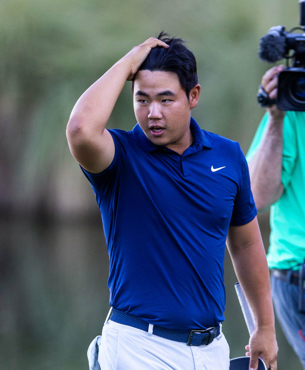 Tom Kim reacts to sinking his final putt for the win at hole 18 during final day play at the Sh ...