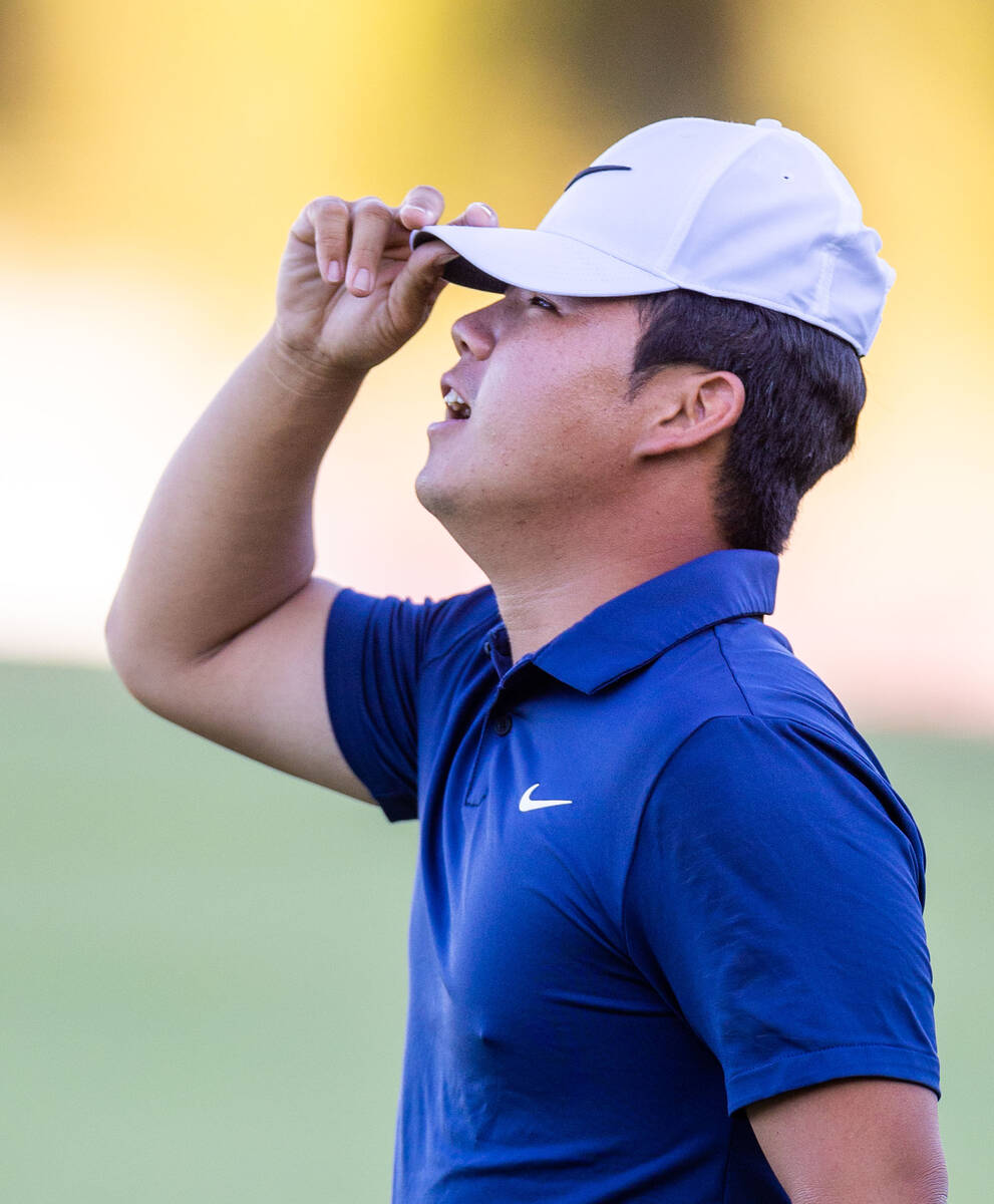 Tom Kim reacts to sinking his final putt for the win at hole 18 during final day play at the Sh ...