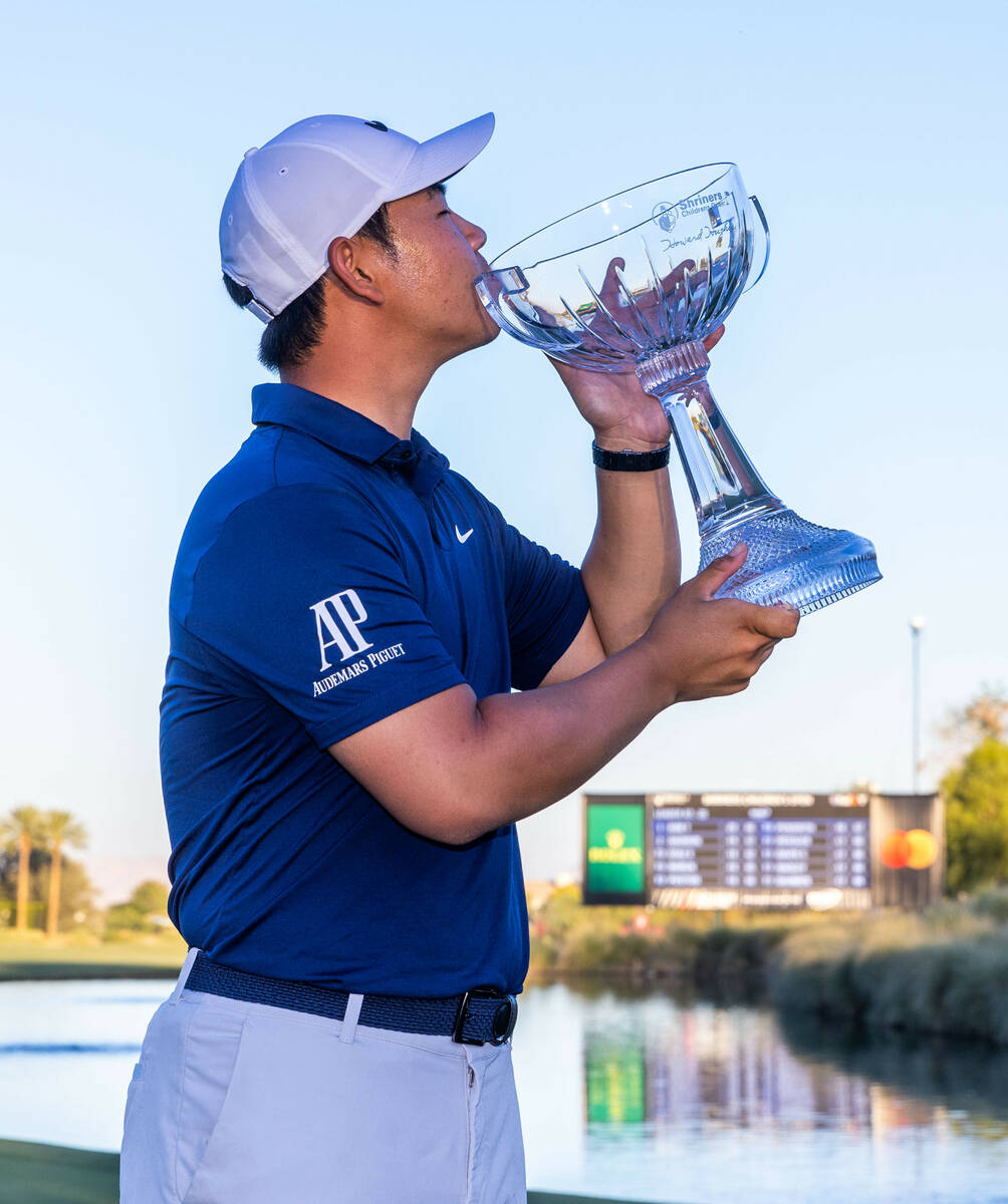 Tom Kim kisses the winning trophy on final day play at the Shriners Children's Open from TPC Su ...