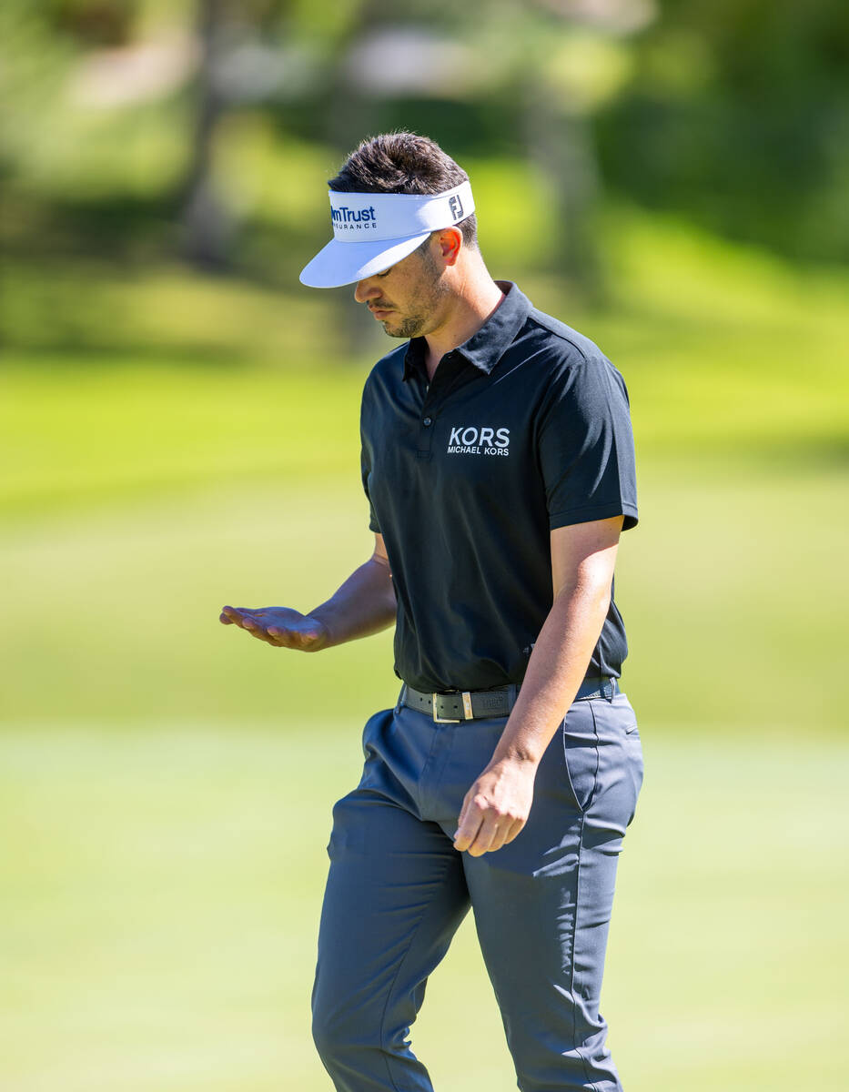 Beau Hossler looks to his hand after a putt on hole 9 during final day play at the Shriners Chi ...