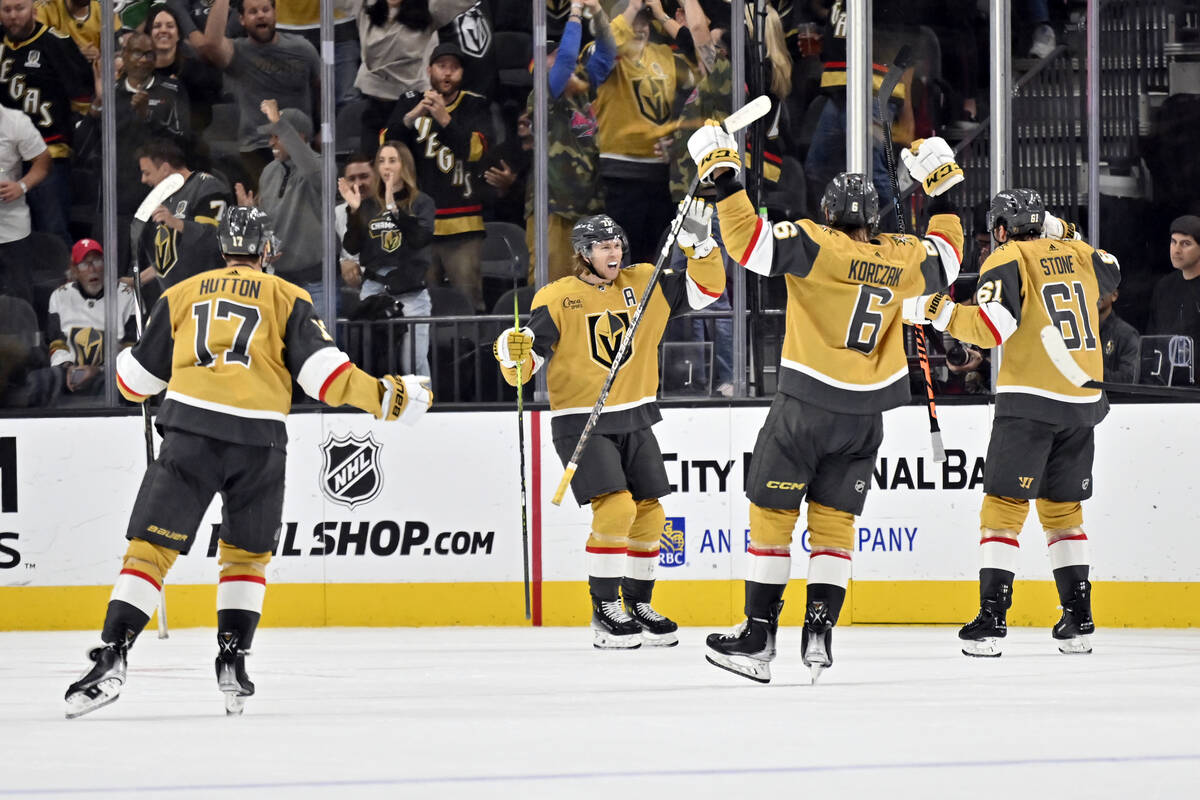 The Vegas Golden Knights celebrate center William Karlsson's (71) goal during the third period ...