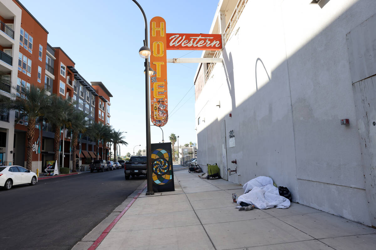 People sleep on 9th Street near Fremont Street in downtown Las Vegas Tuesday, Oct. 17, 2023. (K ...