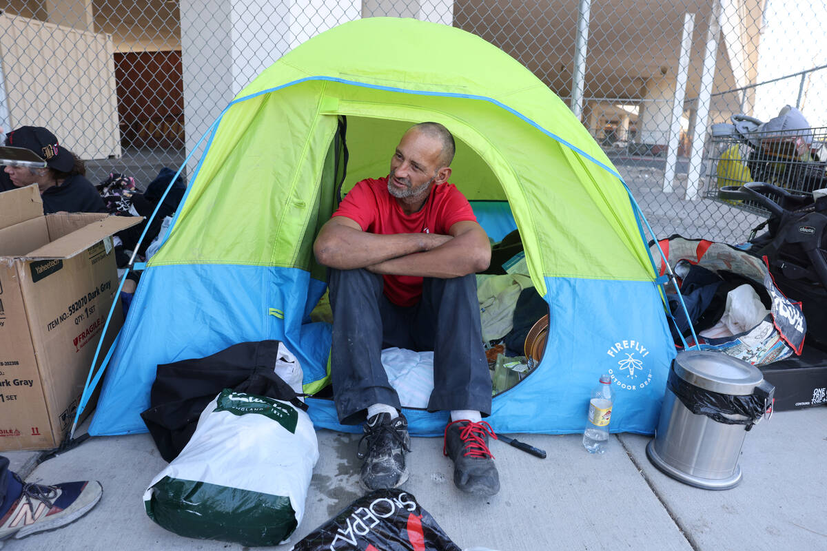 Marcus Copeland, 43, talks to a reporter at his shelter on 9th Street under the U.S. Highway 95 ...