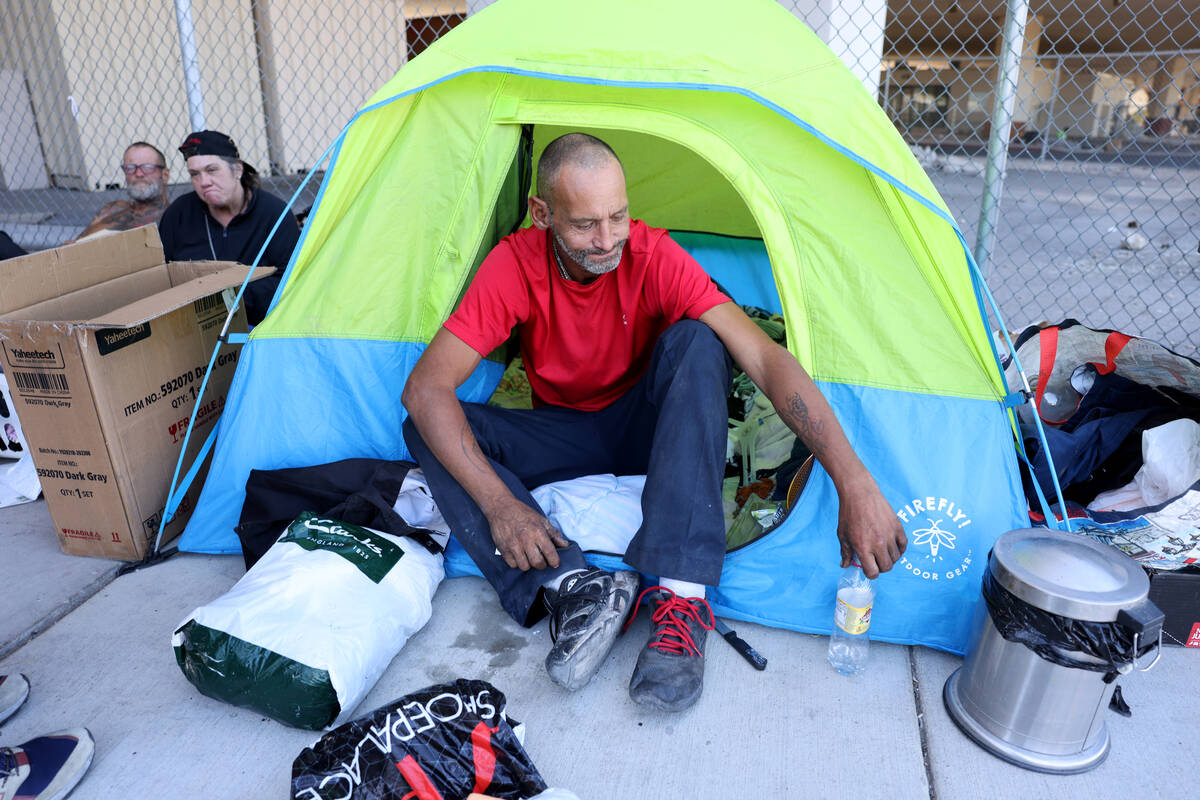 Marcus Copeland, 43, rests at his shelter on 9th Street under the U.S. Highway 95 bridge in dow ...