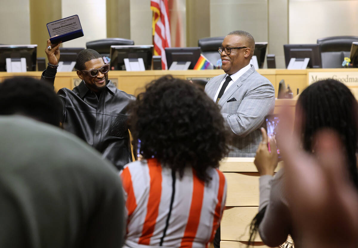 Usher Raymond IV shows his key to the City of Las Vegas during a ceremony at City Hall Tuesday, ...