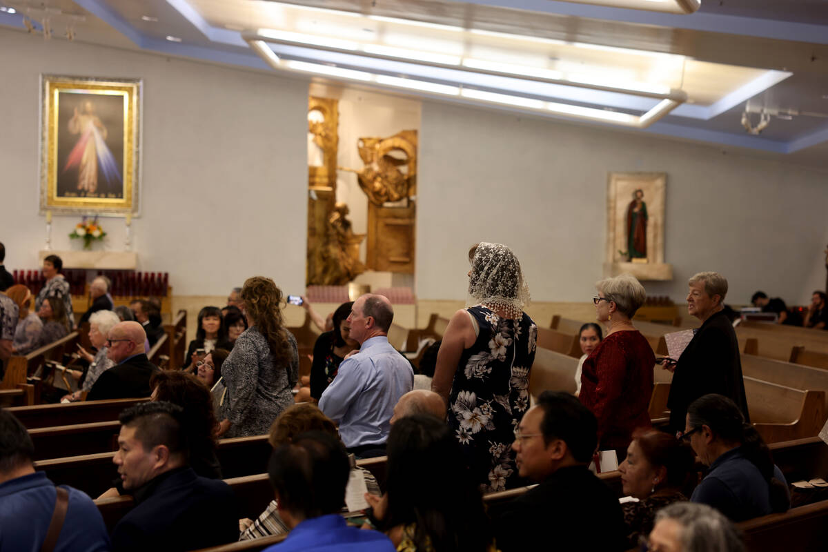 People wait for the imposition of the Pallium Mass at the Shrine of the Most Holy Redeemer in L ...