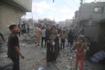 Palestinians flee Israeli bombardment of Rafah, southern Gaza Strip, Tuesday, Oct. 17, 2023. (A ...