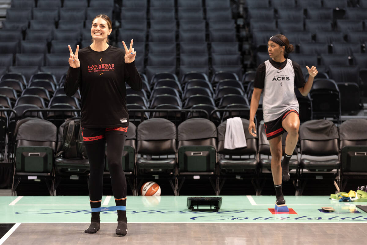 Las Vegas Aces forward Cayla George gives peace signs while warming up during a media availabil ...