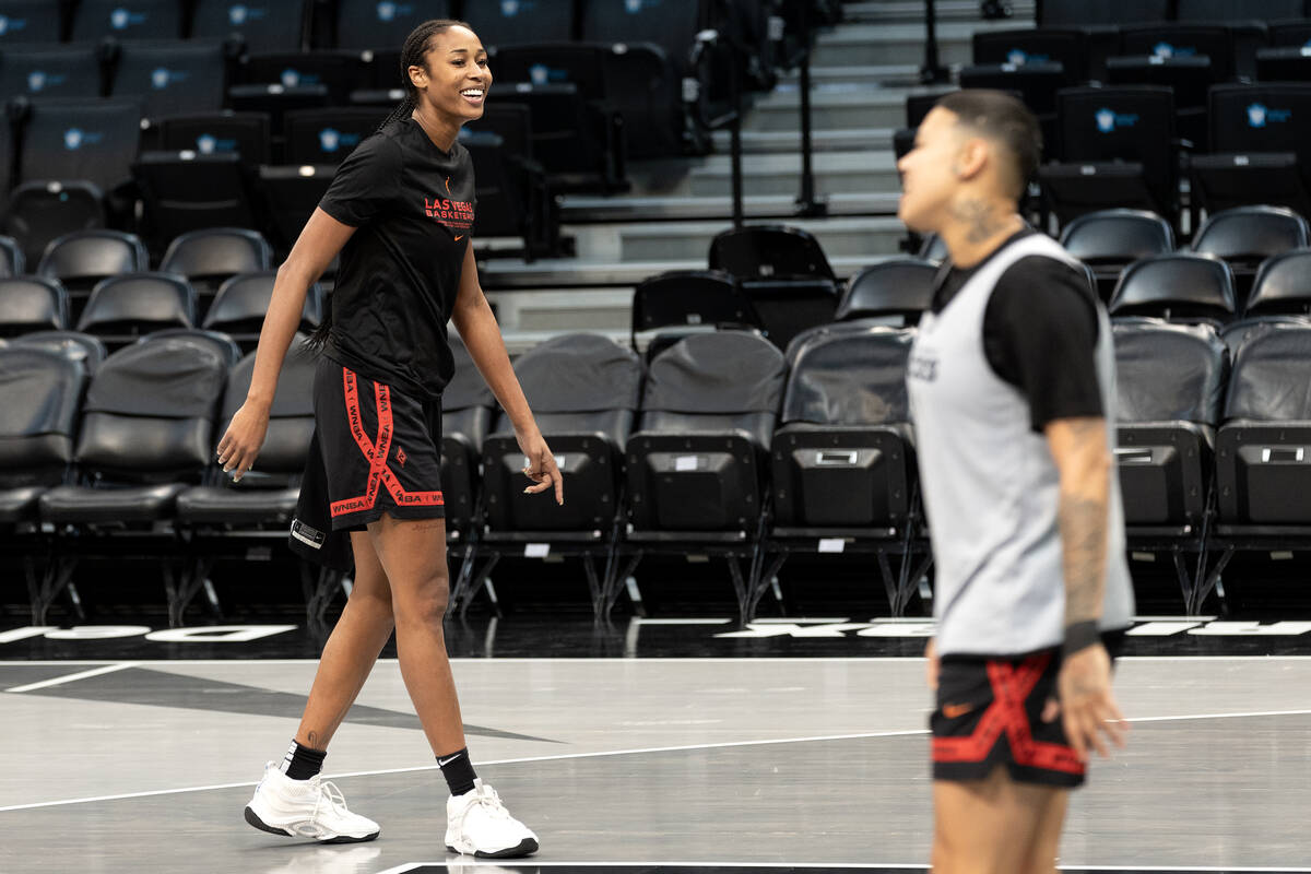 Las Vegas Aces center Alaina Coates, left, and guard Kierstan Bell warm up for practice during ...