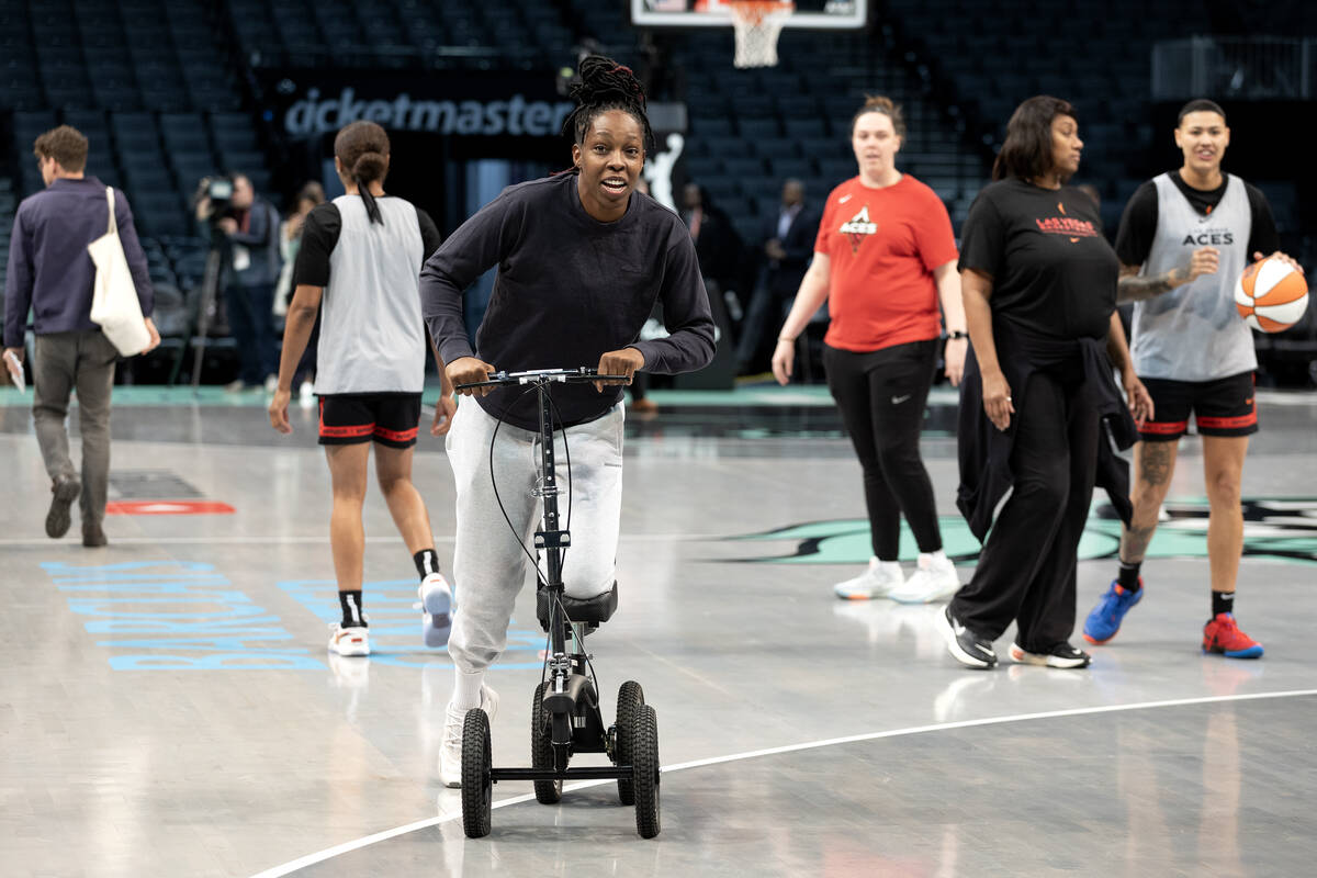 Las Vegas Aces guard Chelsea Gray, who was injured during Game 3, scoots around the court durin ...