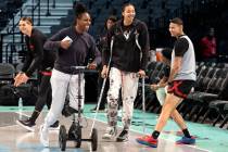 Las Vegas Aces center Kiah Stokes and guard Chelsea Gray, both injured in Game 3, goof off whil ...