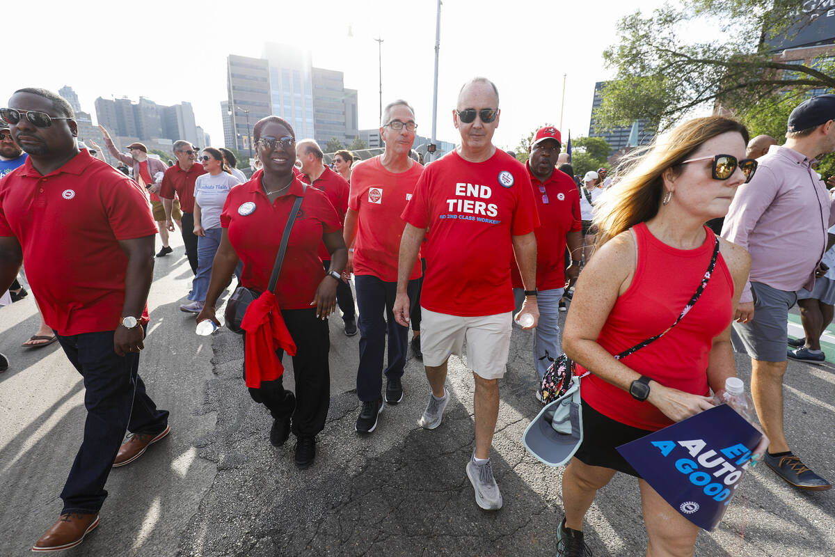 United Auto Workers President Shawn Fain marches in the Detroit Labor Day Parade on Sept. 4, 20 ...