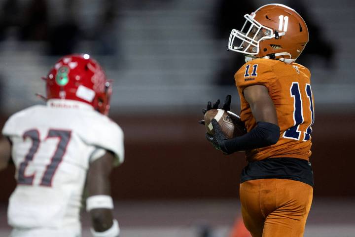 Legacy wide receiver De'Qua Simon (11) catches the ball before running a 53-yard gain while Arb ...