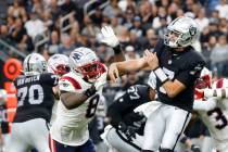Raiders quarterback Brian Hoyer (7) throws under pressure against New England Patriots during t ...