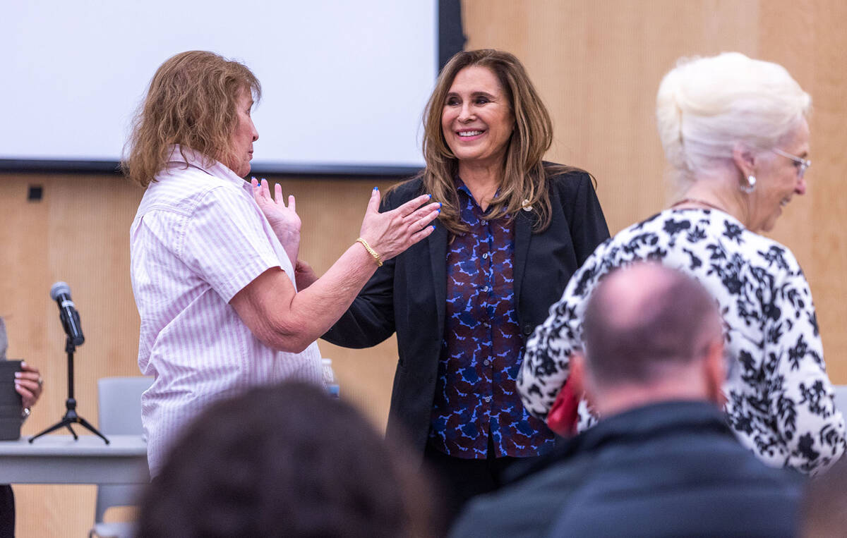 Victoria Seaman, center, speaks with an audience member during a forum at the East Las Vegas Li ...