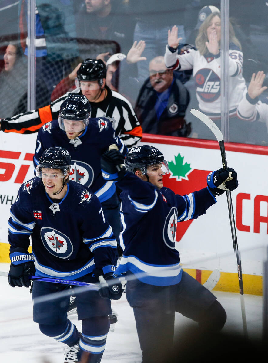 Winnipeg Jets' Cole Perfetti (91) celebrates after his goal against the Vegas Golden Knights du ...