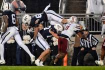 Penn State tight end Theo Johnson (84) scores a touchdown during the second half of an NCAA col ...