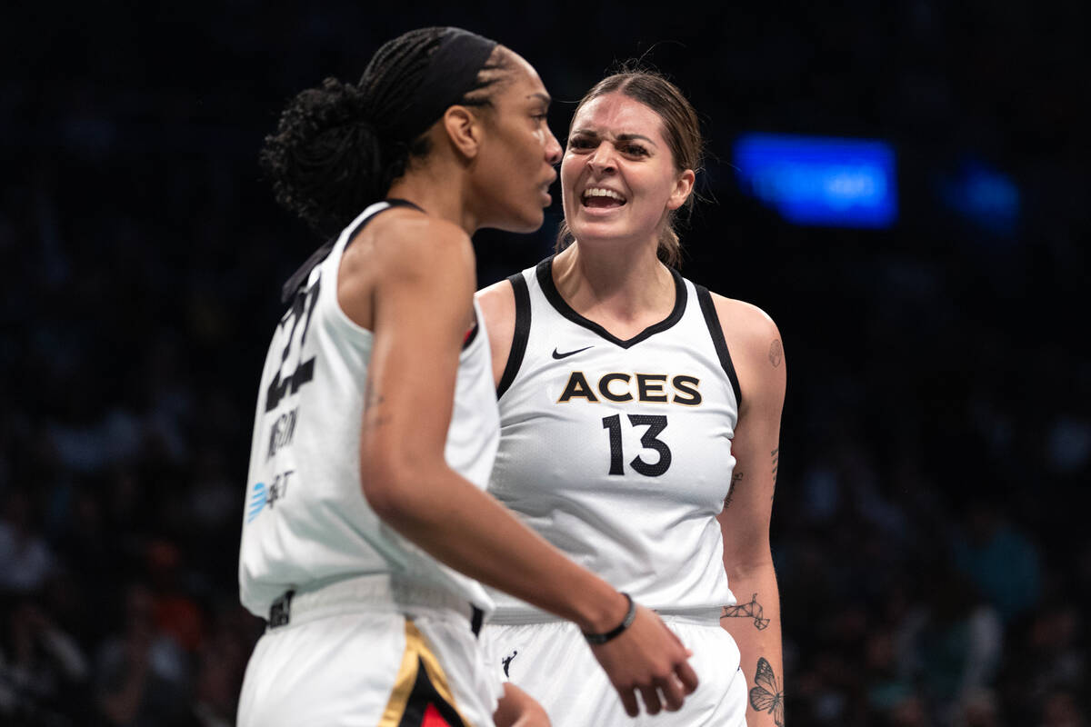 Las Vegas Aces forward Cayla George (13) celebrates with forward A'ja Wilson (22) made a block ...