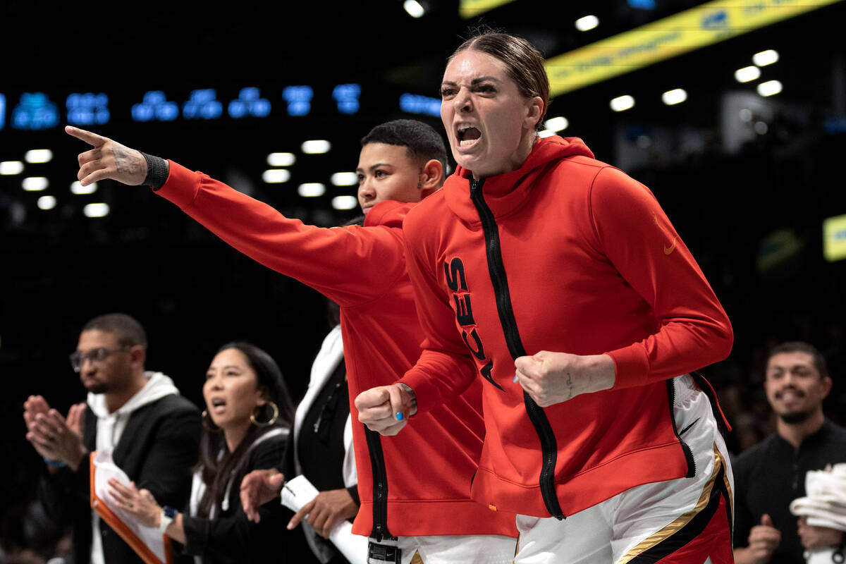 Las Vegas Aces guard Kierstan Bell (1) and forward Cayla George (13) celebrate after the Aces s ...