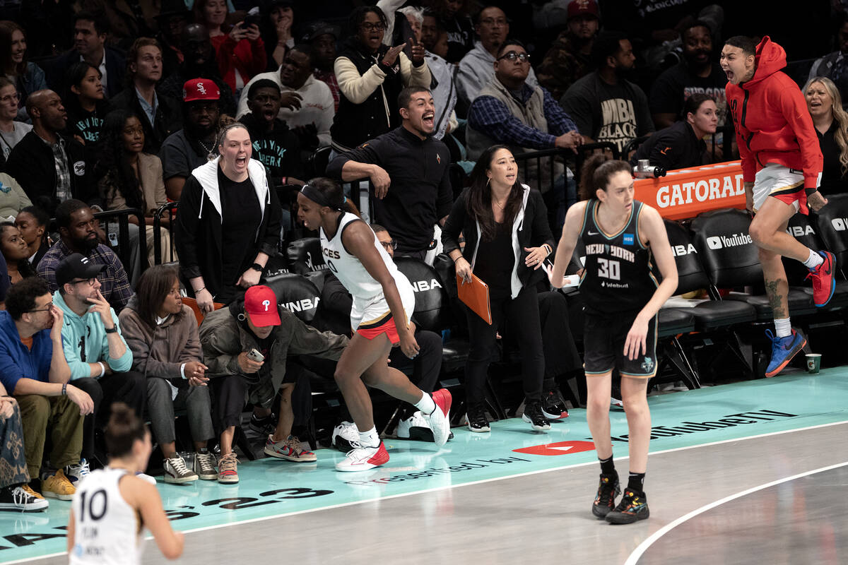Las Vegas Aces guard Jackie Young (0) celebrates with her bench and University of South Carolin ...