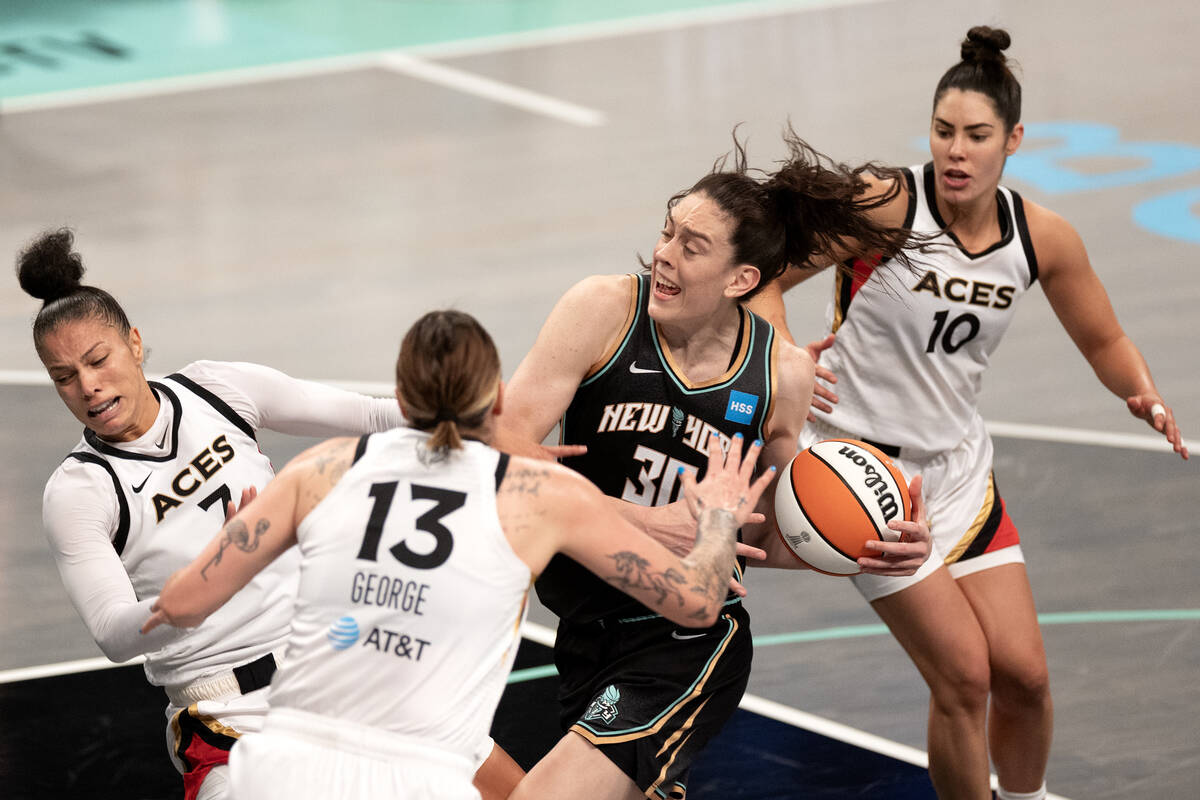 New York Liberty forward Breanna Stewart (30) drives toward the hoop but commits an offensive f ...